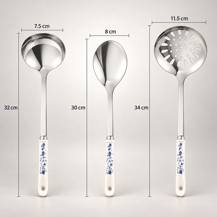 Three stainless steel kitchen utensils with blue-and-white patterned handles are shown on a light grey background with dimension labels: a ladle 7.5 cm wide and 32 cm tall, a spoon 8 cm wide and 30 cm tall, and a slotted spoon 11.
