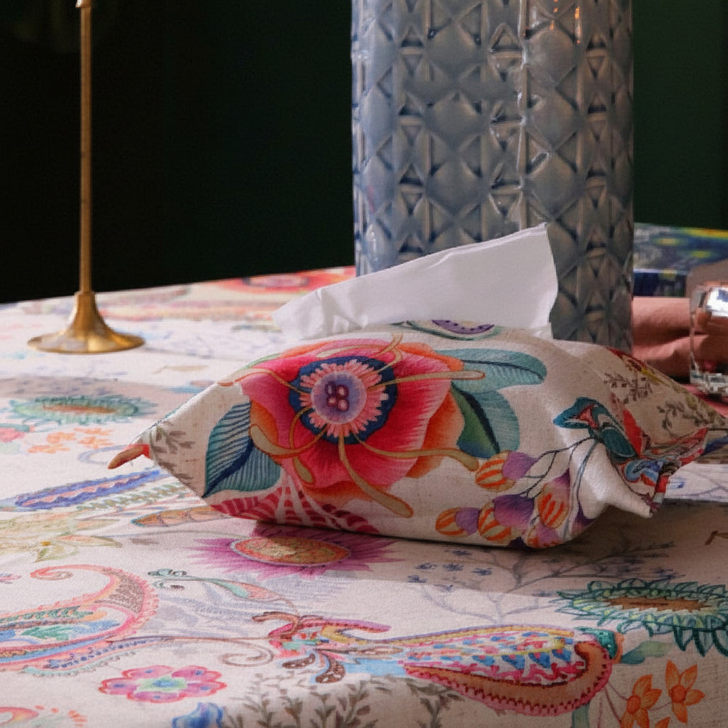Close-up of Château Jardin linen tablecloth pattern and texture with pillow on top
