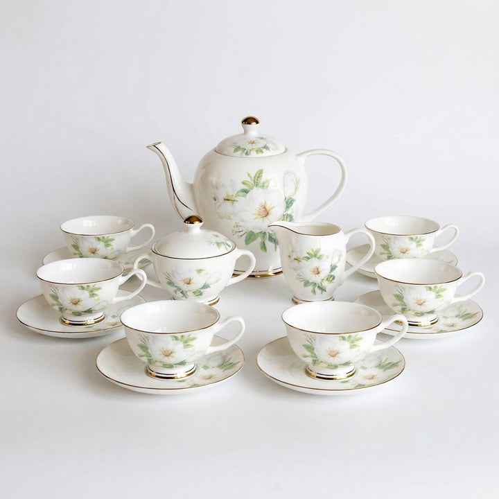 Ivory Camellia fine bone china tea set with white floral pattern and gold detailing on a white background