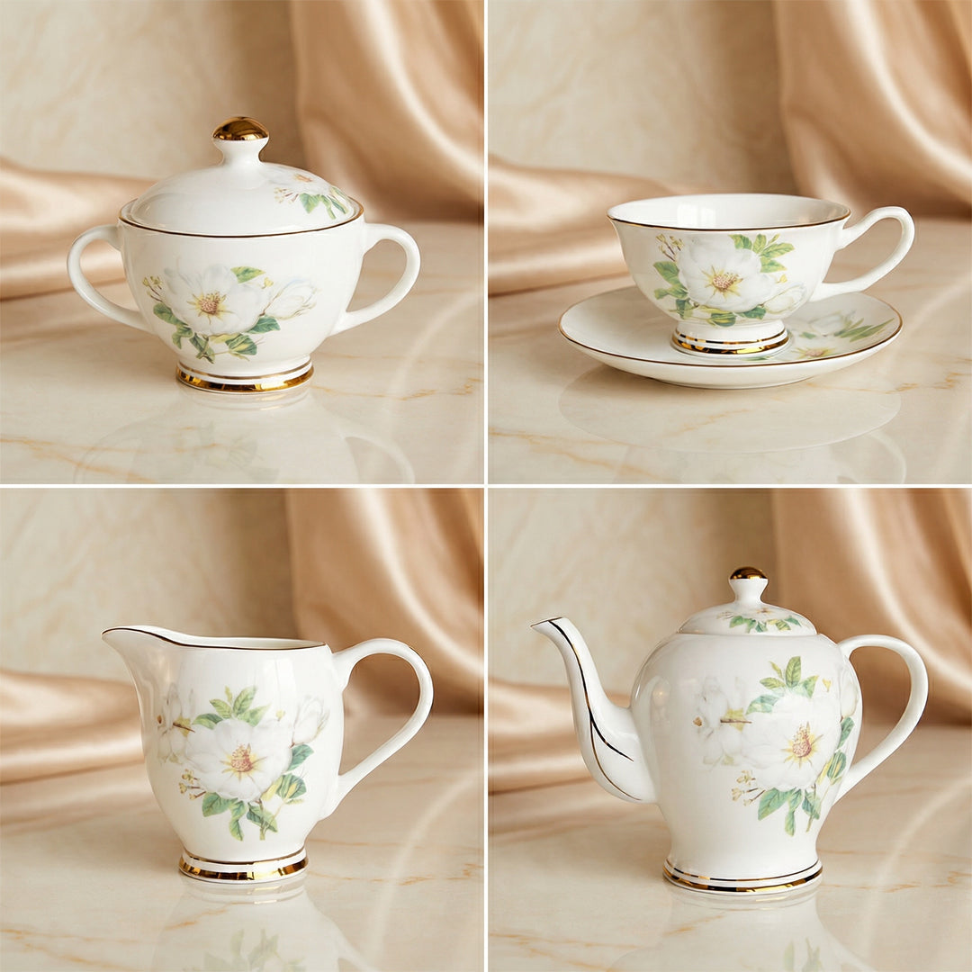 Ivory Camellia tea set close-up showing teapot, teacup, milk jug and sugar bowl with floral pattern and gold detailing