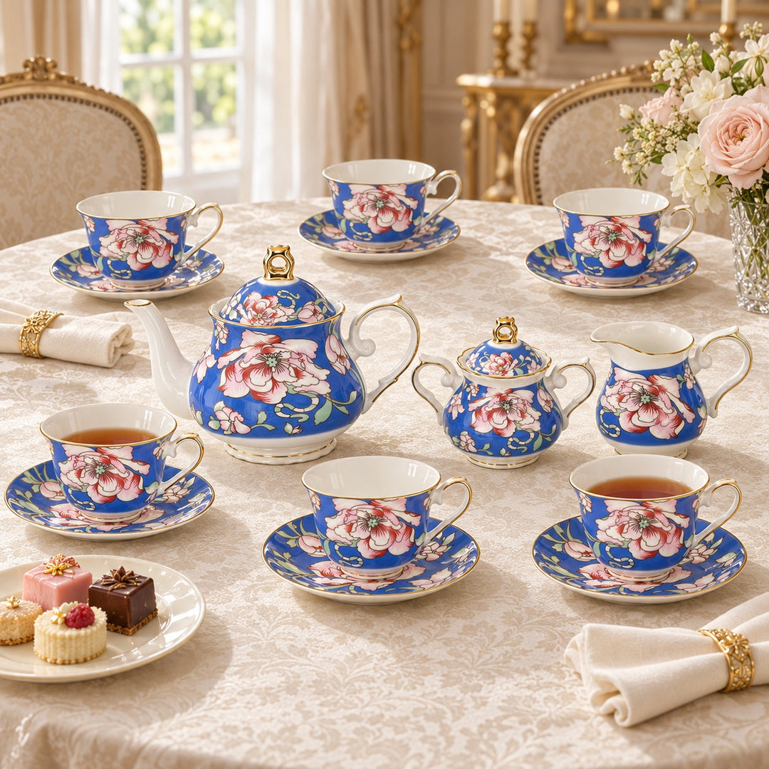 Rosewood Garden floral tea set arranged for afternoon tea on a cream tablecloth with cakes and flowers