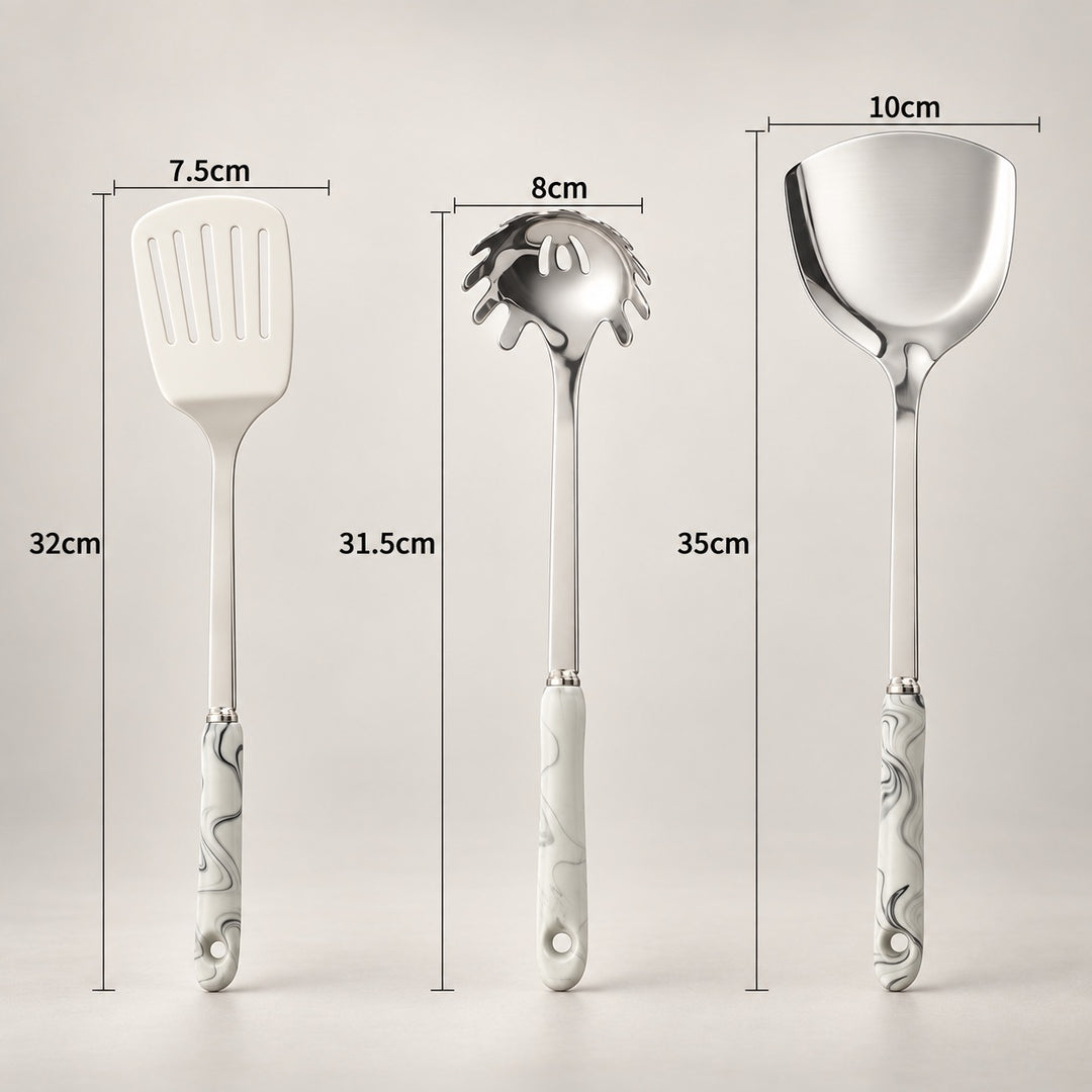 Three stainless steel kitchen utensils with grey marbled pattern handles are shown on a light grey background, each with its width and total length labelled in centimetres: a spatula at 7.5cm wide by 32cm long, a spaghetti server at 8cm wide by 31.