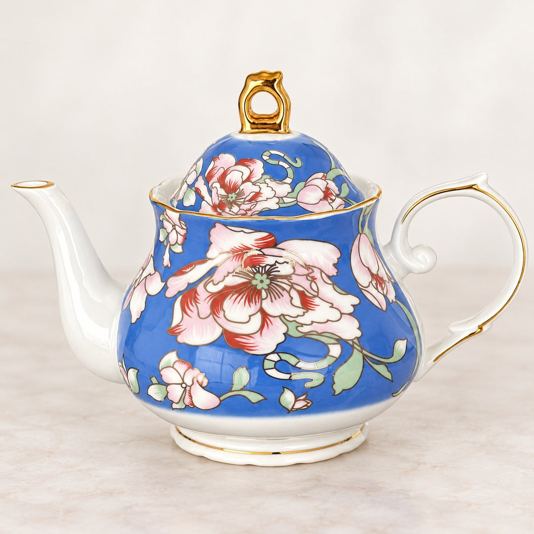 Rosewood Garden blue floral teapot with pink and ivory flowers, gold detailing and a white handle