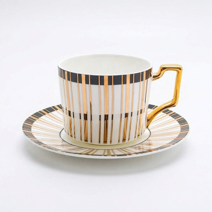 Tuxedo Gilt fine bone china teacup and saucer with black band and 22k gold detailing on a white background