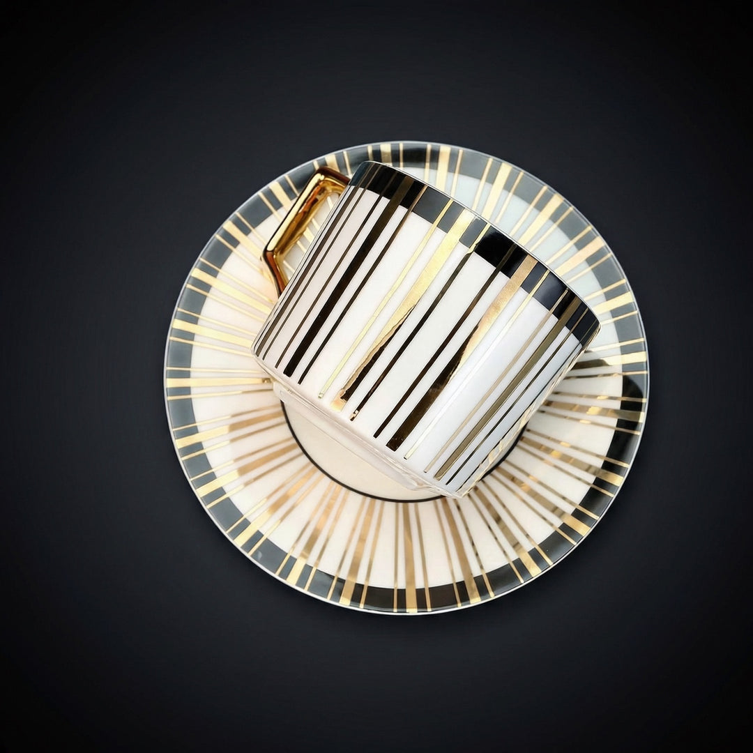 Top view of Tuxedo Gilt teacup and saucer showing black band and 22k gold striped design