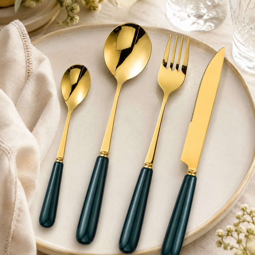 Forest Green and gold ceramic-handle cutlery styled on a neutral dinner plate