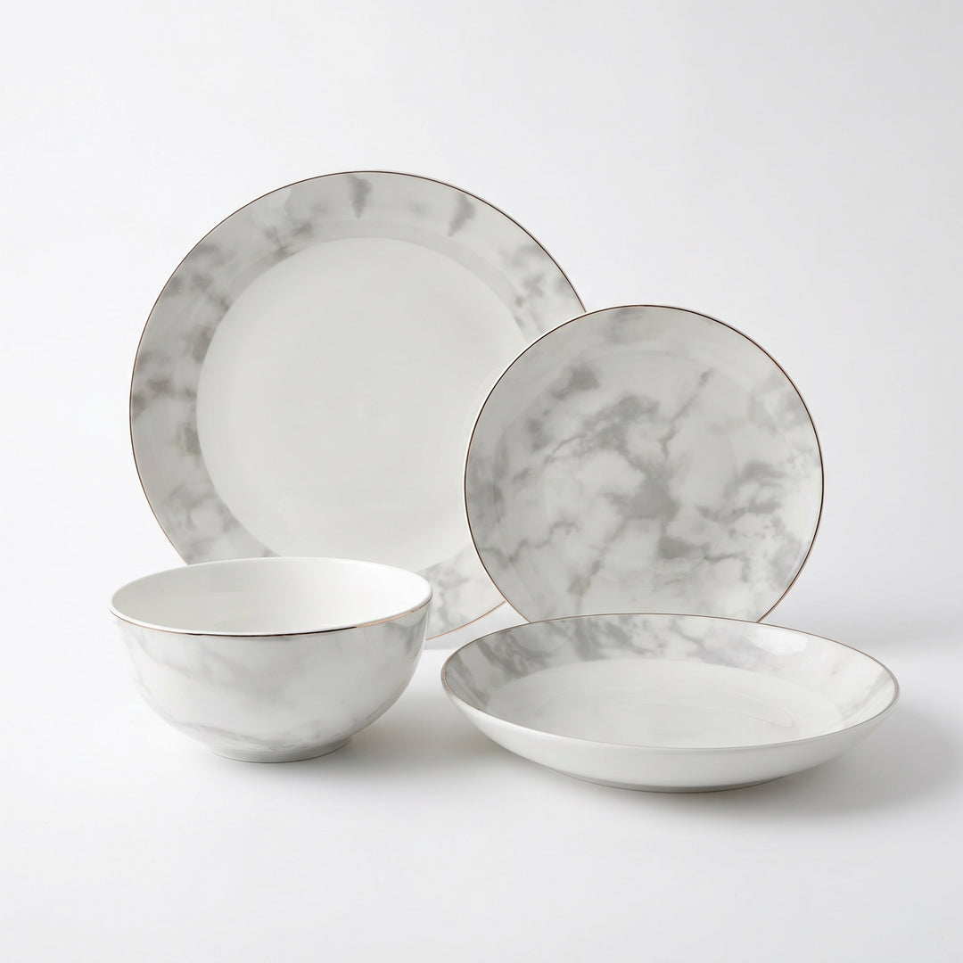 Aurelia 16-piece fine bone china dinner set with marble design and hand-painted gold edge
