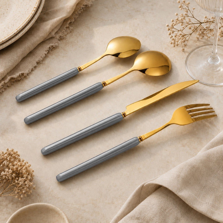 Marlowe Pearl Grey and gold cutlery styled with neutral table linen
